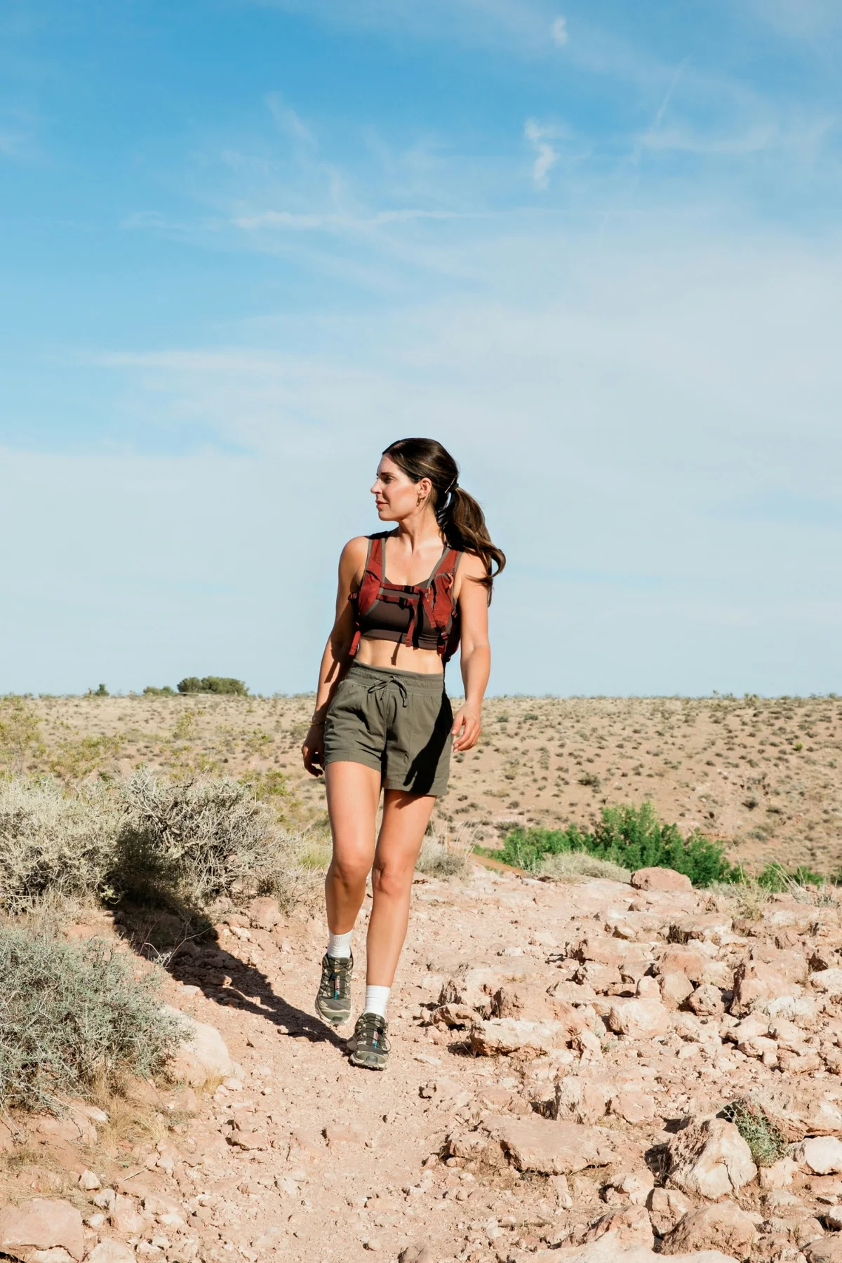 A woman hiking through the high desert