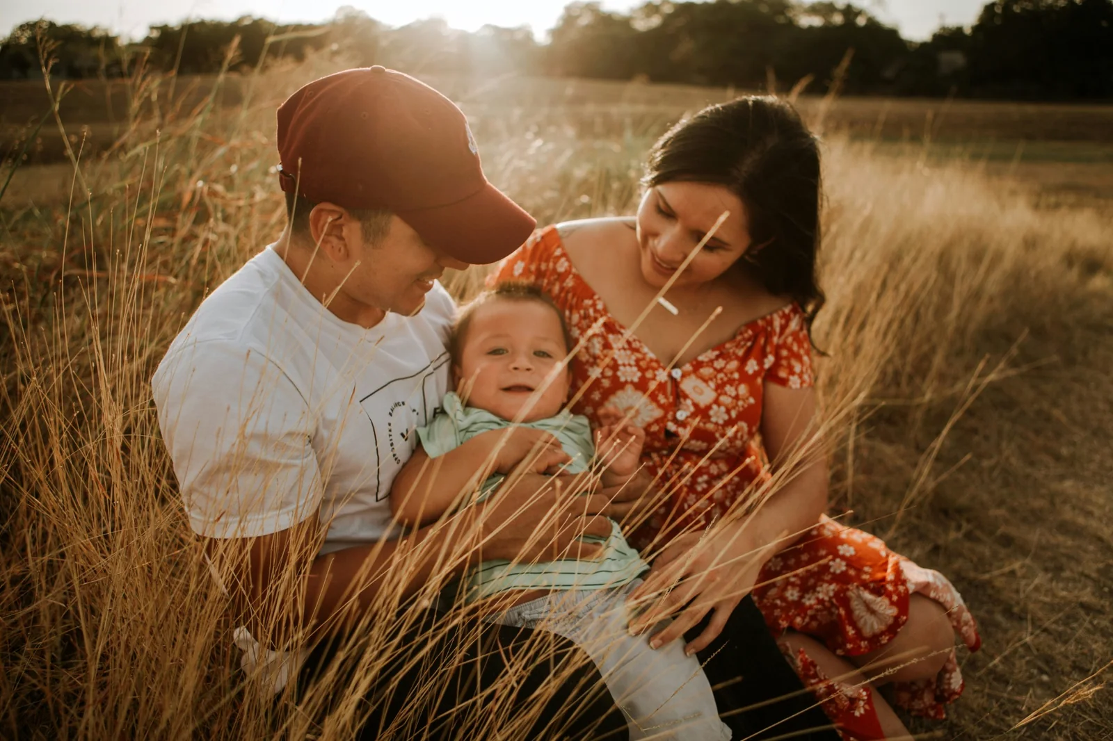 Family together outdoors in warm evening light
